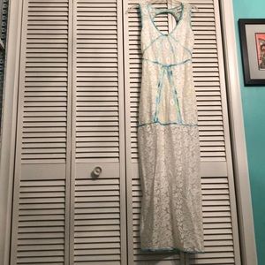 white lace dress with blue and green detail